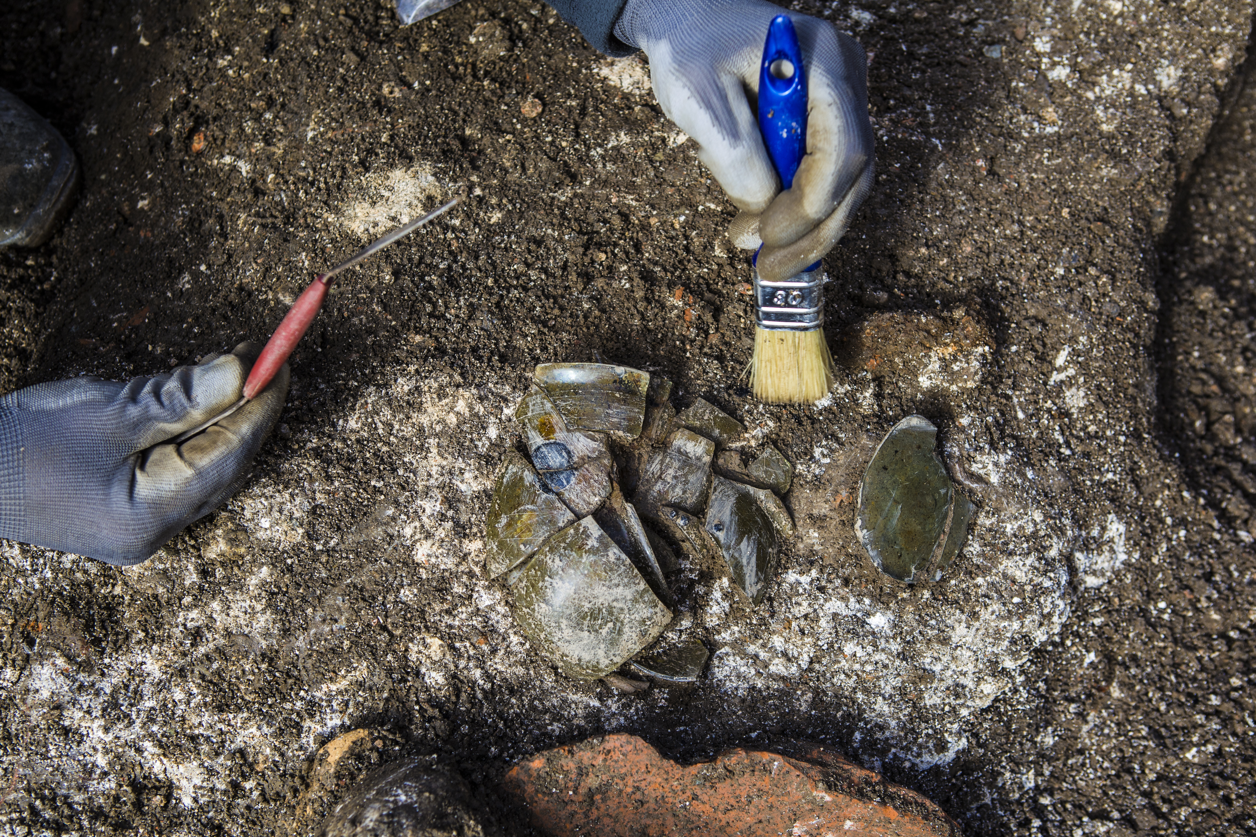 A decorated Roman glass chalice as found at the site of discovery.